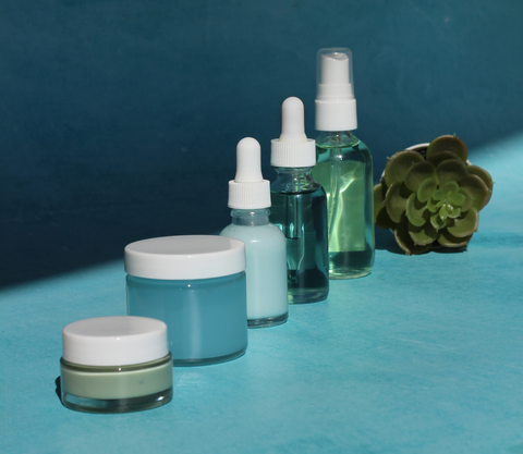 Image of various skincare products lined up, including moisturizers, serums, and toners.